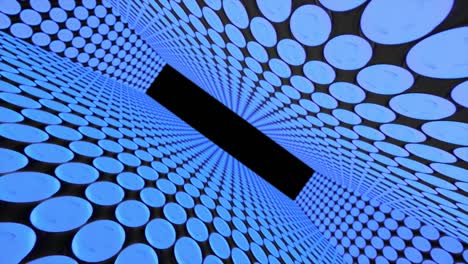 abstract creative tunnel with dots. geometric design, swirling, rotating camera and alpha channel end of tunnel.