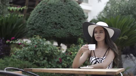 woman enjoying a drink outdoors