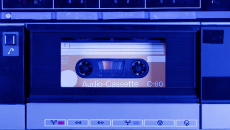 vintage audio cassette in tape recorder