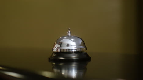 woman ringing the reception bell