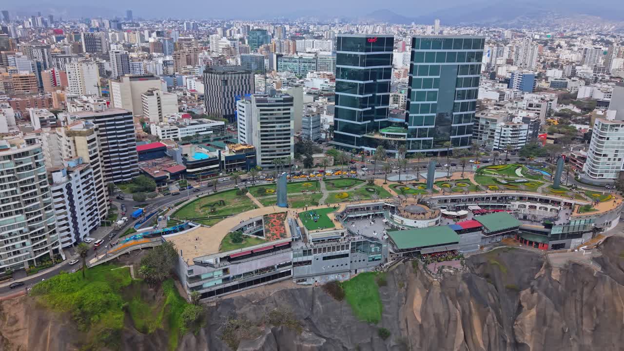Panning shot of Larcomar mall on Lima's coastline in vibrant Miraflores