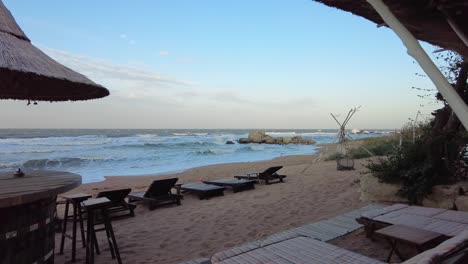 serene beach view with loungers and ocean waves