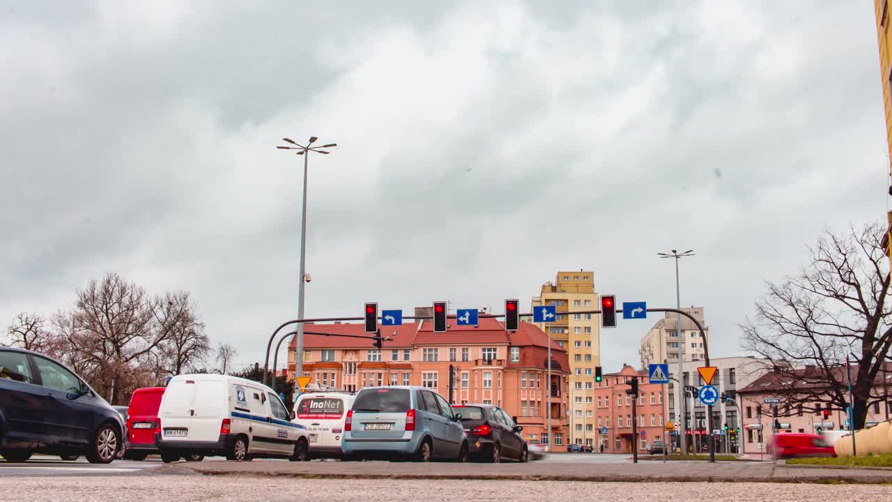 A Time-lapse of Traffic and Pedestrian Movement at a Traffic Intersection in Bydgoszcz, Poland on a Cloudy Day.