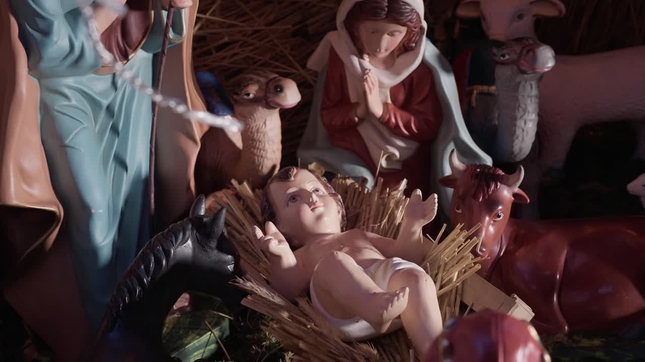 detailed nativity scene featuring baby Jesus in a straw manger, surrounded by Mary, Joseph, and animals