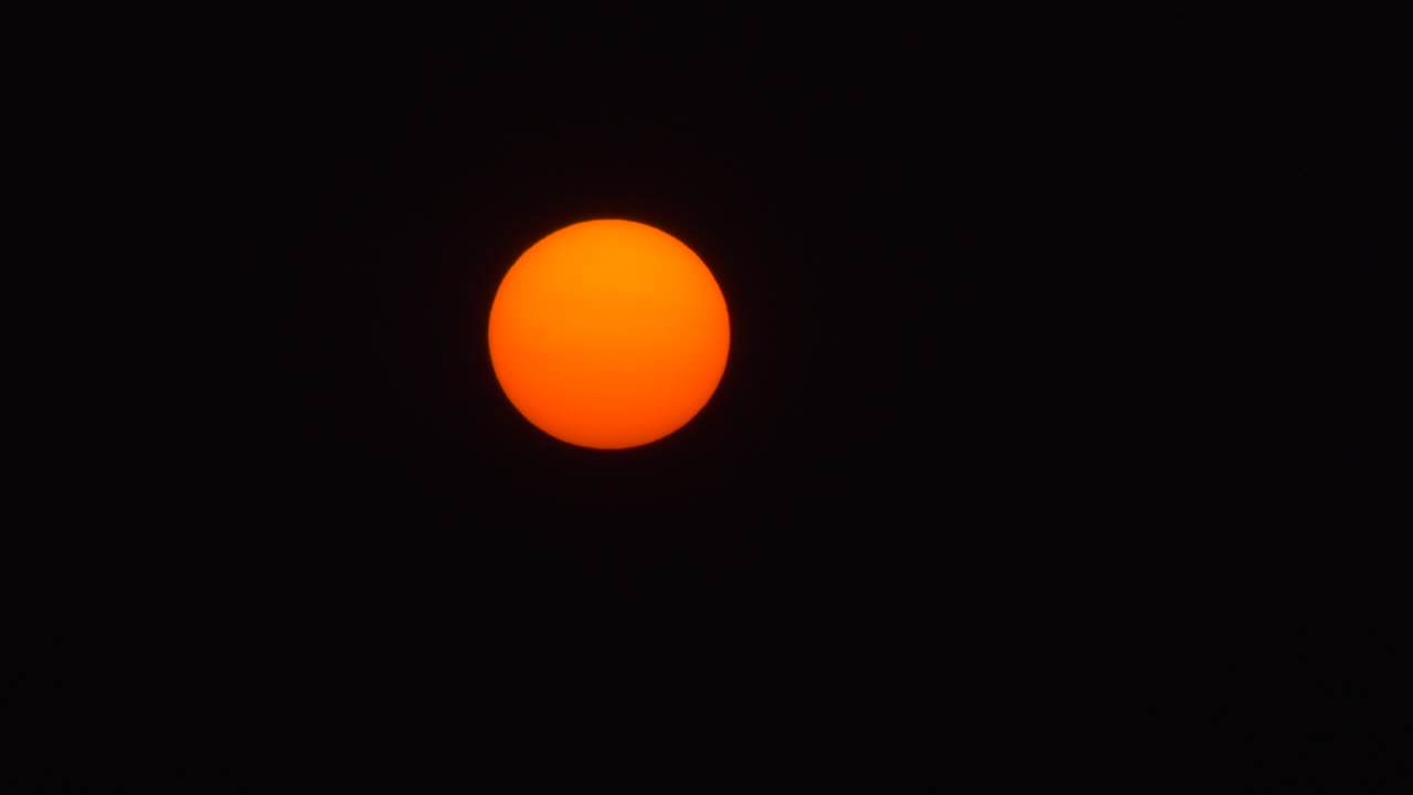 Orange Moon Obscured By The Wildfire Smoke At Night In Capitol Hill In Burnaby, British Columbia, Canada