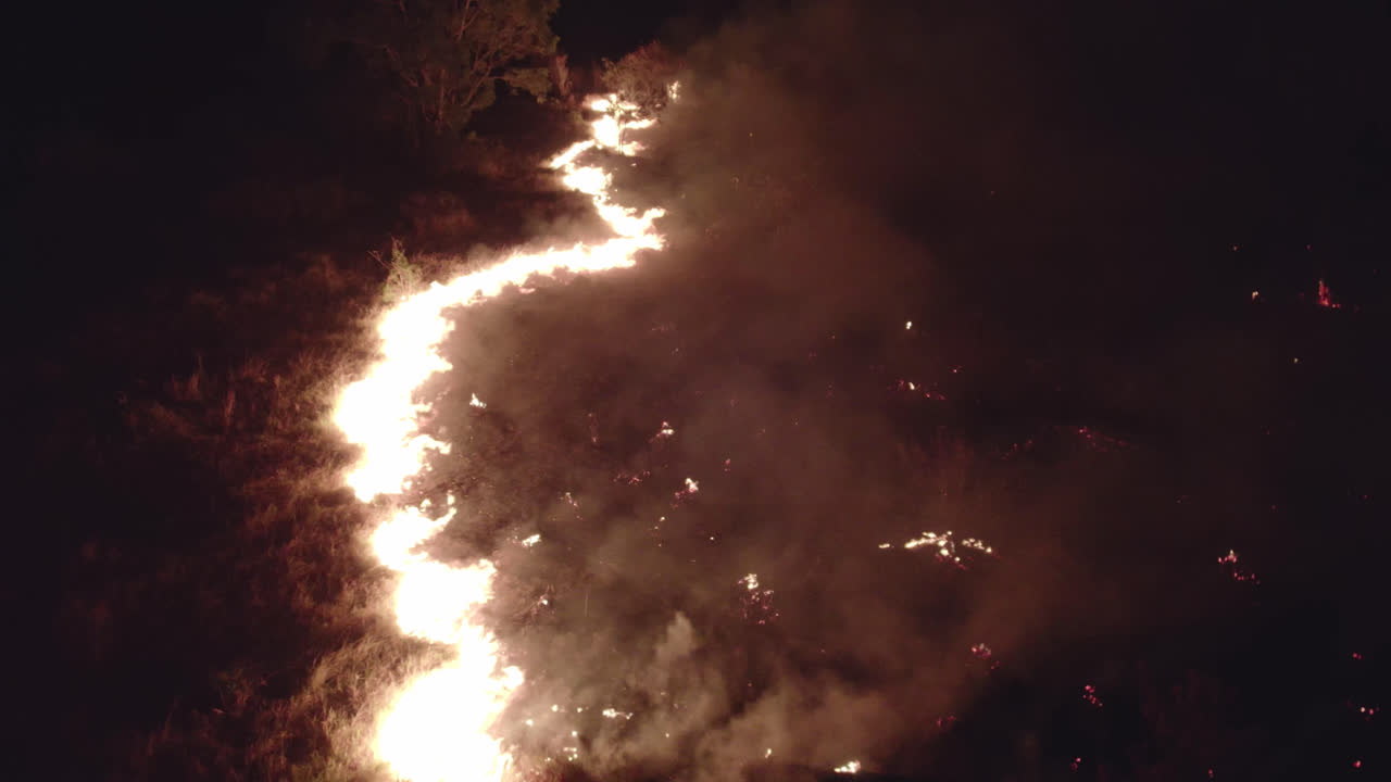 Climate change - Aerial view of the wild fire in large area showing line of destruction