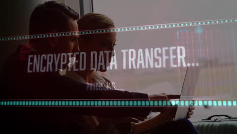 business professionals working on laptop with data processing animation overlay