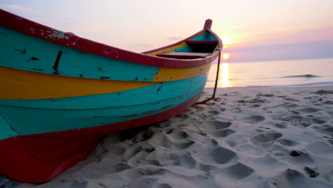 colorful wooden boat on the beach at sunrise/sunset