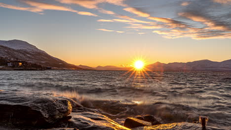 scenic sunset on the shore after polar night season in tromso, norway