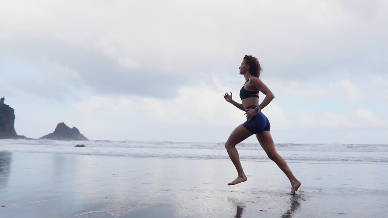 Woman Running on the Beach at Sunset