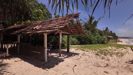 abandoned looking sun shade shelter on the beach sri lanka remote paradise