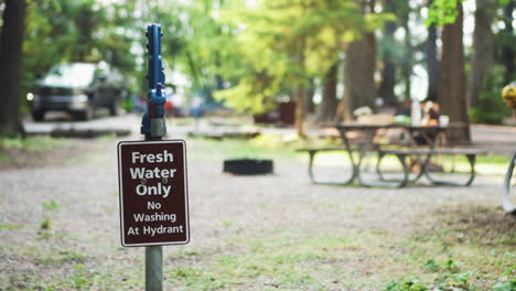 close up view of a drinking water faucet in a park, campground and creek, glacier national park montana