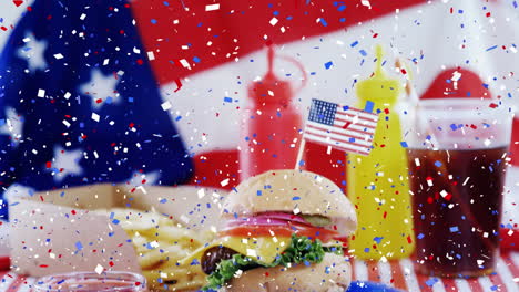 confeti colorido cayendo sobre la comida rápida contra nuestra bandera
