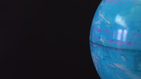 side of the globe on a dark background