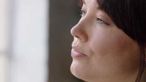 portrait happy caucasian woman drinking coffee looking out window enjoying successful lifestyle planning ahead independent female relaxing at home close up