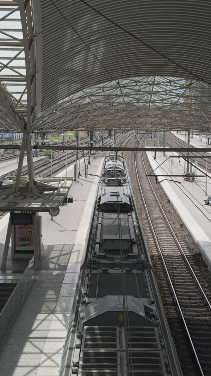 Static shot of train arriving at the train station in Leuven, Belgium
