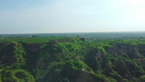 Aerial-drone-shot-of-an-Abandoned-ancient-fort-on-top-of-a-forest-hill-in-Dholpur-,-Rajasthan-,-India