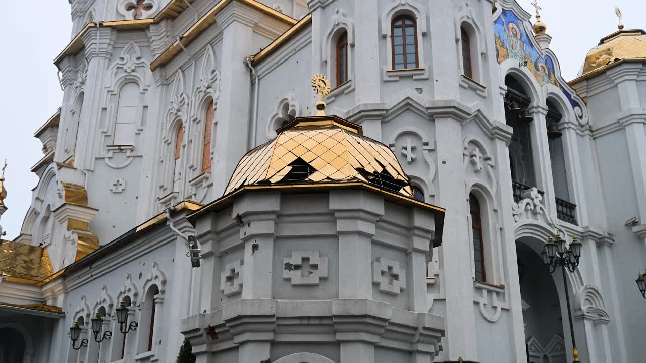 The scars of war on a sacred landmark in Kharkiv, Ukraine. This close-up shows shrapnel damage to the Holy Myrrh-Bearing Women Church after a Russian attack