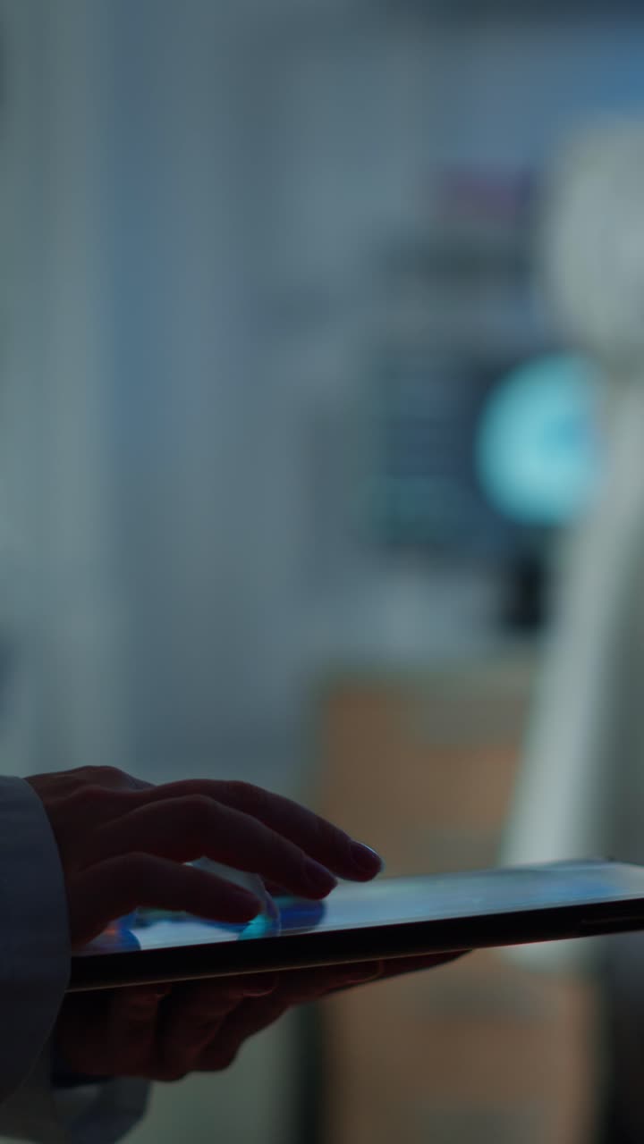 Hands interacting with a digital tablet in a professional or medical environment