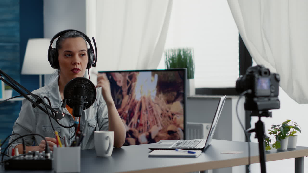 Digital content creator recording video in living room studio while tweaking knobs on mixer