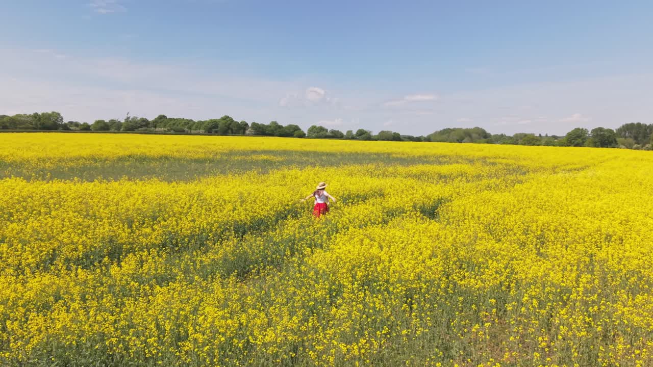 A cinematic footage of a woman walking freely into a blooming field, surrounded by vibrant flowers and gentle sunlight, embodying peace, joy, and the essence of freedom