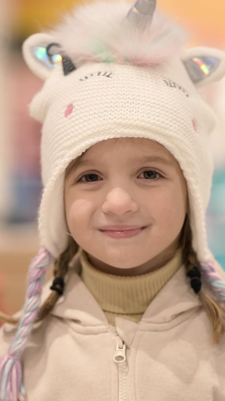 Girl Wearing a Unicorn Hat