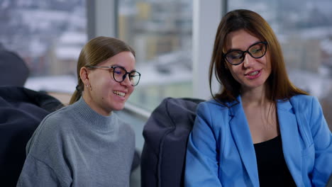 businesswomen in conversation in a modern office