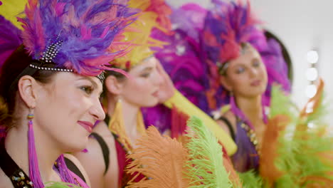 showgirls getting posing in front of a mirror 1