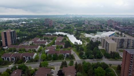 aerial view of mississauga apartment buildings and a pond