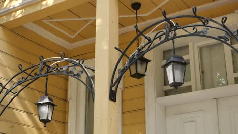 wrought iron lanterns above a doorway