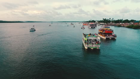 aerial shot of river on joão pessoa, brazil, with boats and peoples