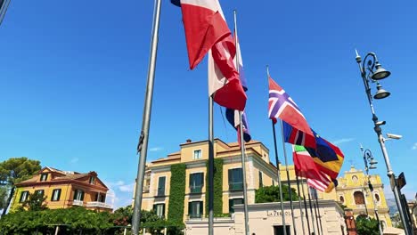 colorful flags fluttering in a sunny italian square