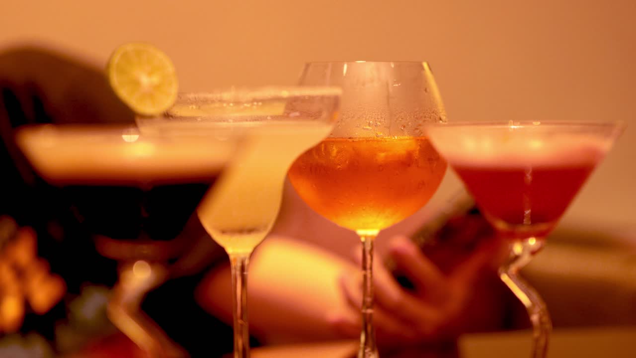 Friends clinking glasses at a lively celebration