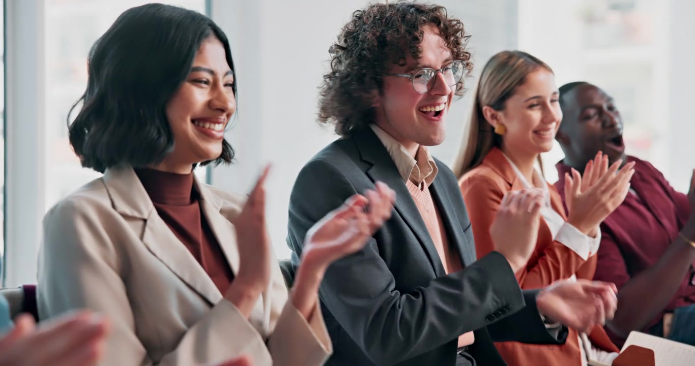 Diverse Group of Professionals Applauding During a Business Meeting