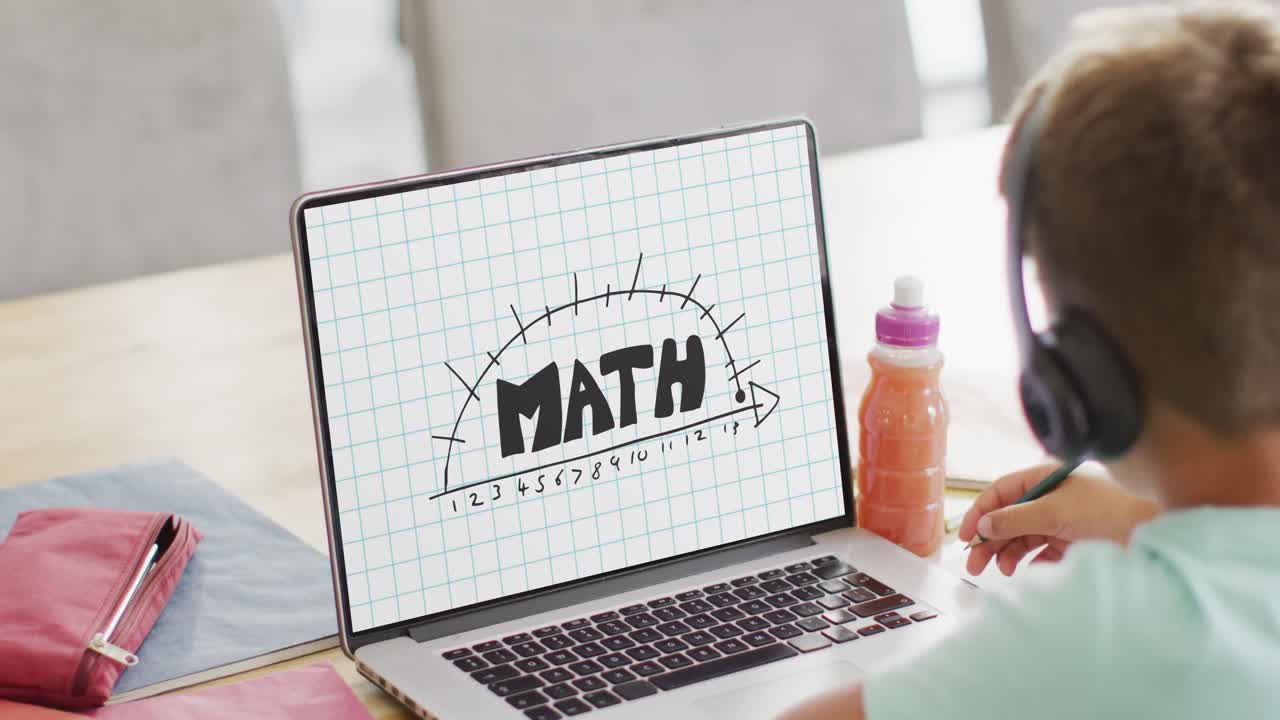 Caucasian boy using laptop with math text on screen