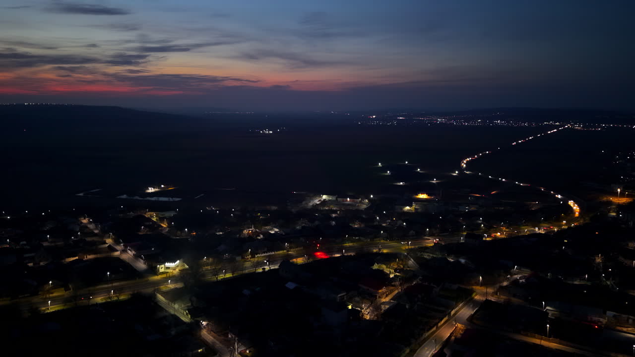 Aerial drone view of cars moving through Chisinau, Moldova at sunset