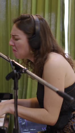 woman singing and playing piano