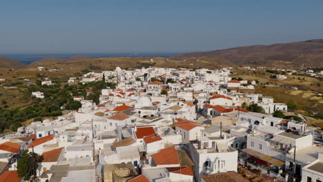 kythnos chora village on kythnos island during sunrise, cyclades, establishing drone shot