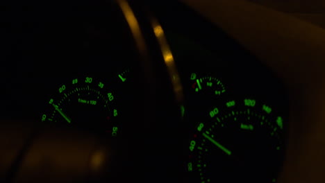 closeup of cars dashboard with speedometer indicating 60 kilometer per hour speed