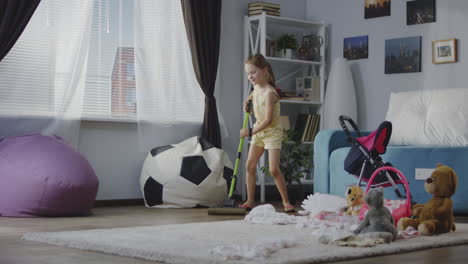 child cleaning up a messy room