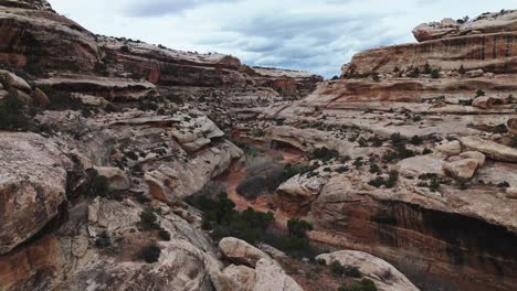 aerial fly over rocky landscape and winding river canyon