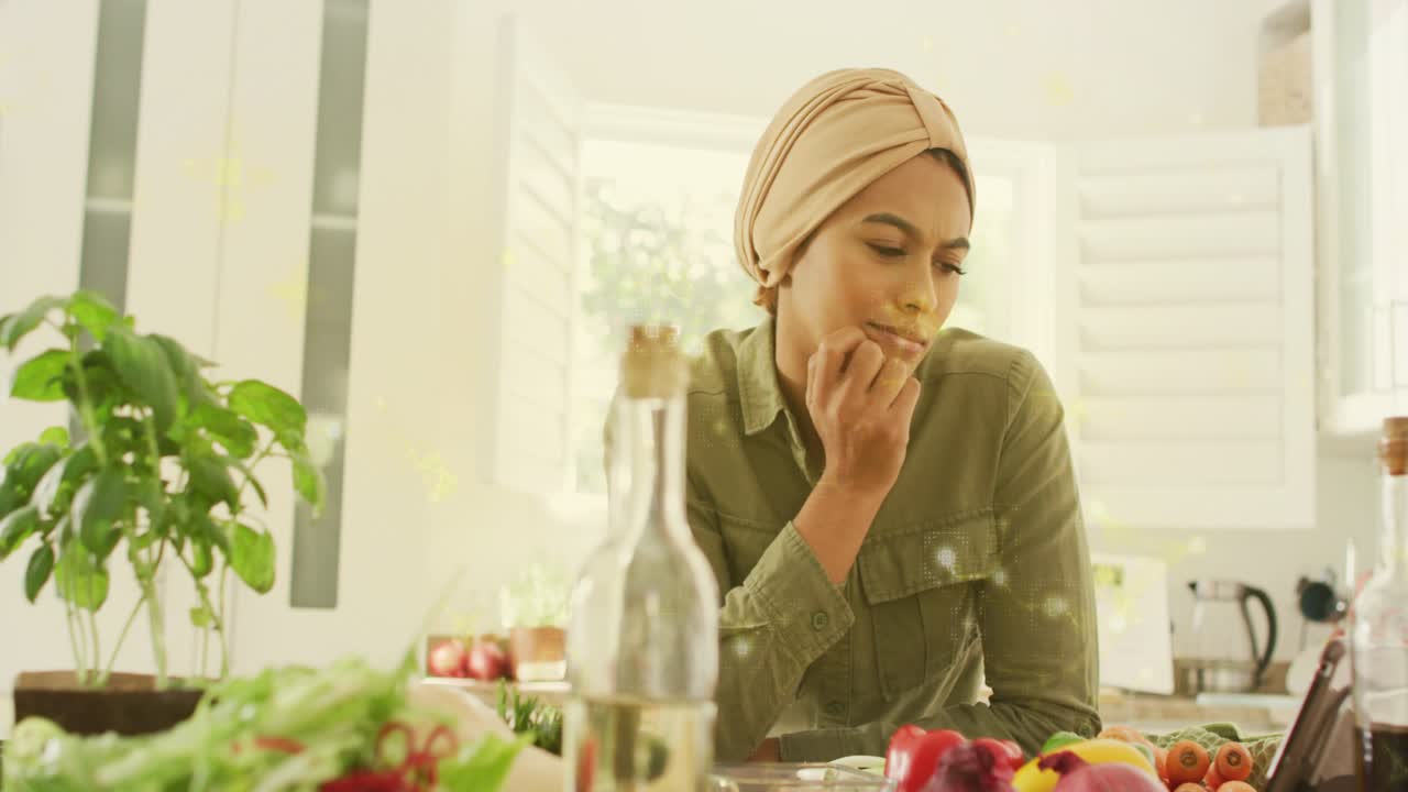 Woman arranging produce and tapping tablet in culinary demo, animating labels and testing flavors