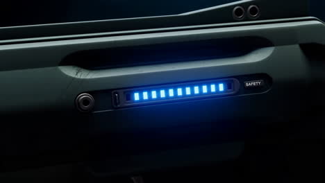 close-up of device with blue lights and safety switch