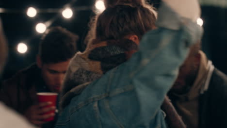 young-caucasian-woman-dancing-group-of-multiracial-friends-having-fun-enjoying-rooftop-party-at-night-laughing-celebrating-friendship