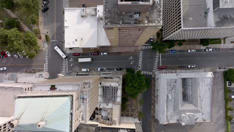 Overhead-drone-view-of-intersection-in-downtown-Mobile,-Alabama-with-video-moving-right-to-left