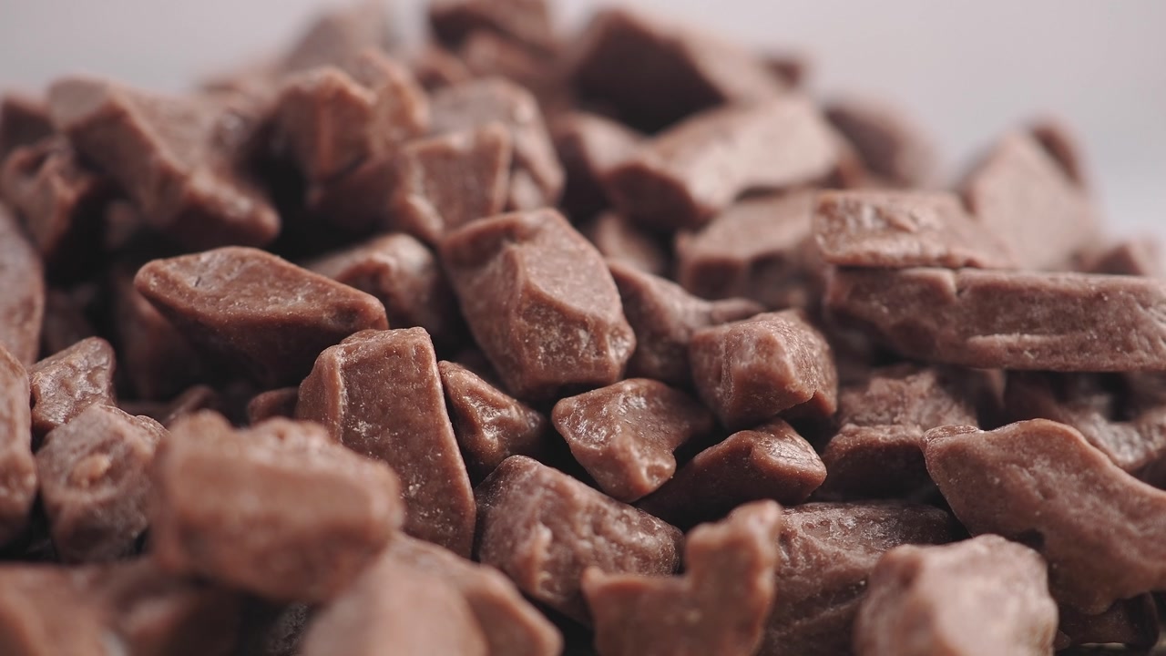 Macro Close-up of a Heap of Small Chocolate Pieces