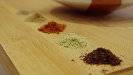 colorful spices on wooden table