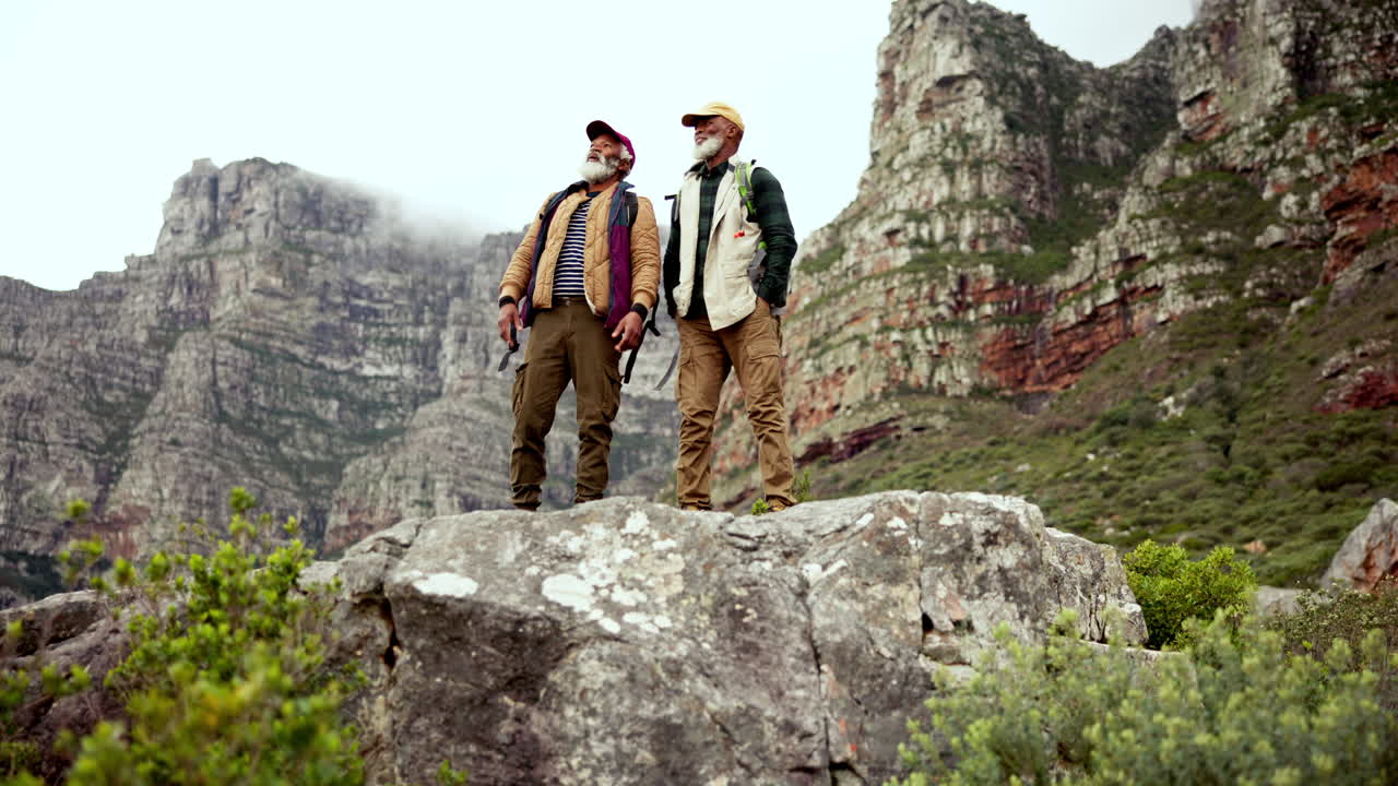 Two Senior Men Hiking in the Mountains