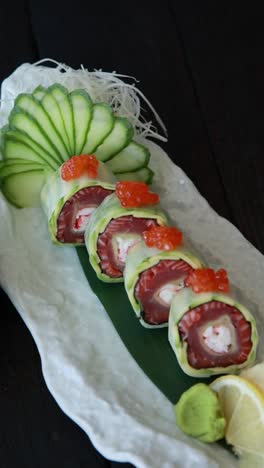 appetizing salmon roll with cucumber garnish