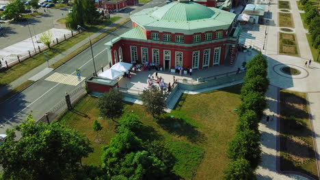 aerial view of a round building with people